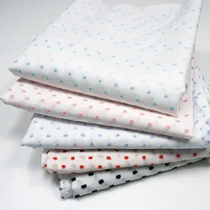 dotted swiss product photo, stack of colors available