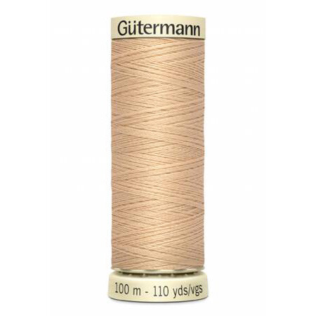 spool of gutermann thread, color sahara