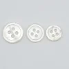 mother of pearl buttons in white product photo