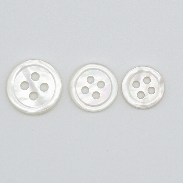 mother of pearl buttons in white product photo