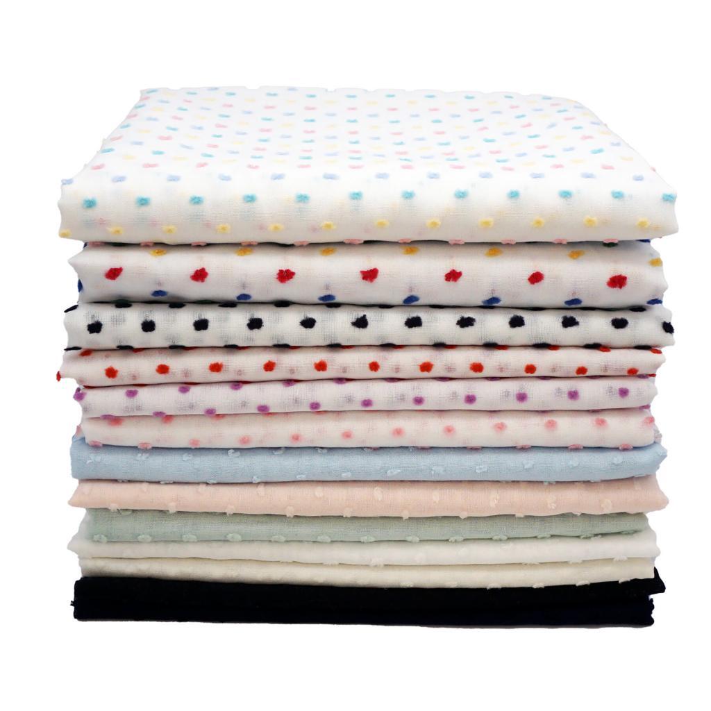 stack of dotted swiss fabrics